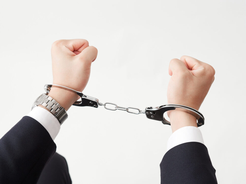 falsely accused man in handcuffs in new jersey; self-defense laws in new jersey concept image