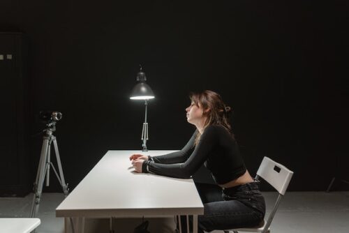 woman in interrogation room