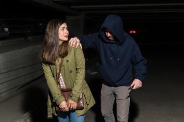 woman being assaulted by man with knife