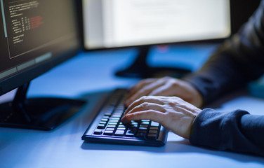 person typing on computer keyboard