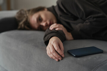 depressed woman with phone