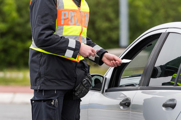 police officer at car window