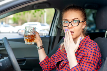 woman holding beer in front seat of car