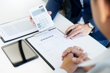 insurance papers and calculator
