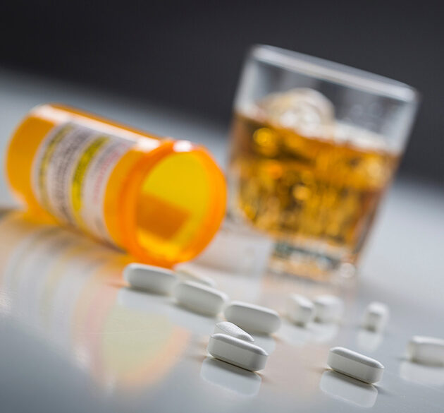 pills and alcohol on a table