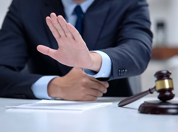 lawyer holding up their hand gesturing