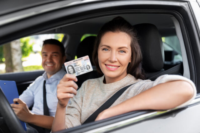 woman holding driver's license
